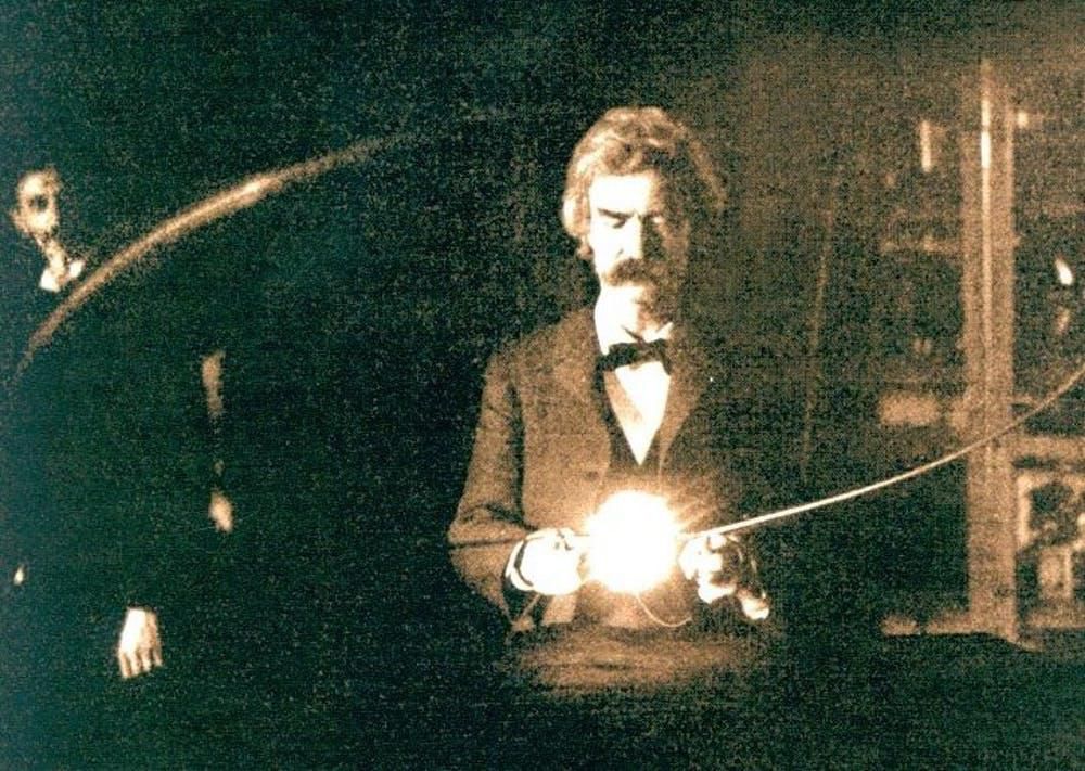 Photo of Mark Twain, a good friend of Nikola Tesla, holding Tesla’s experimental vacuum lamp in 1894