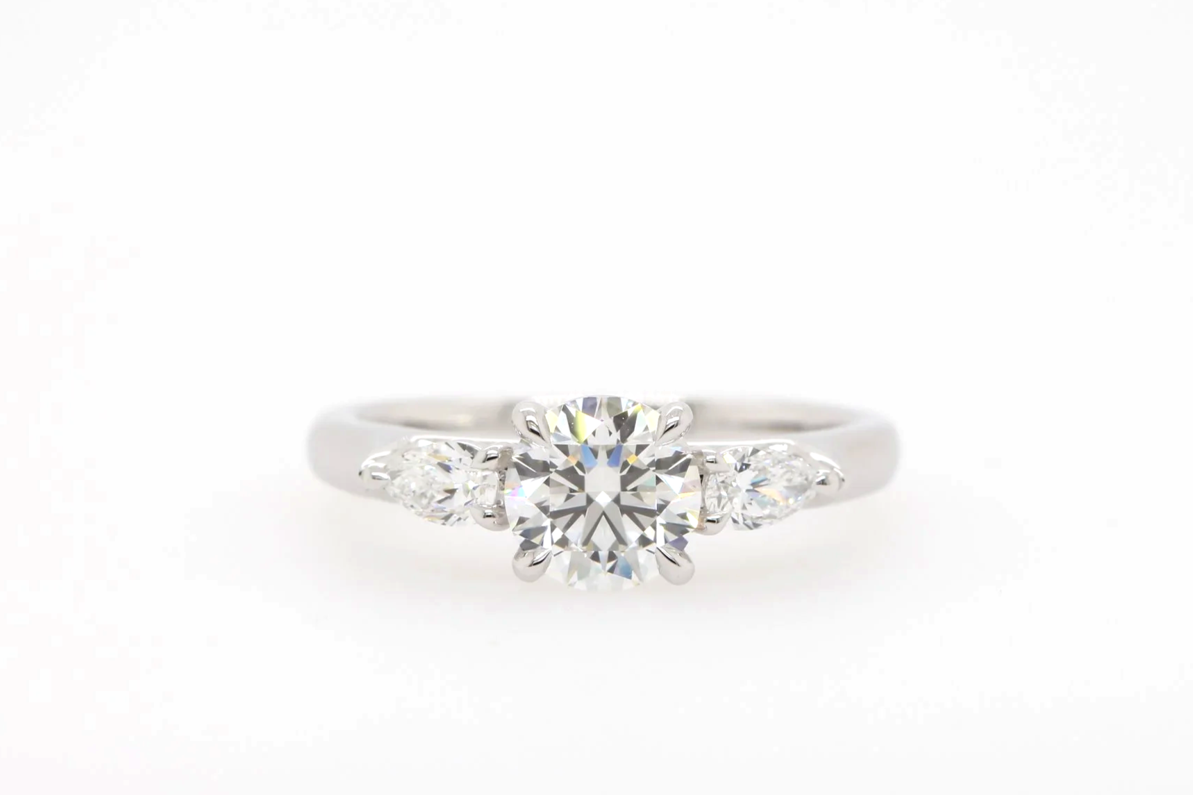 Trilogy Engagement Ring with Round and Pear Shape Diamonds