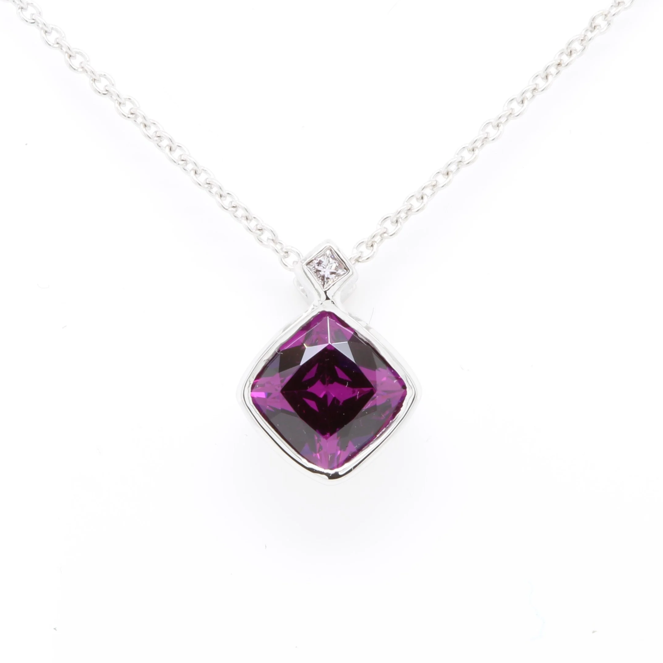 Custom+designed+deep+purple+garnet+and+diamond+pendant.png