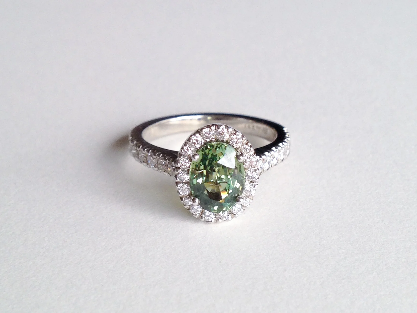 CLAIRE Engagement Ring: ethically-sourced oval green sapphire, pavé diamonds, 18k white gold.