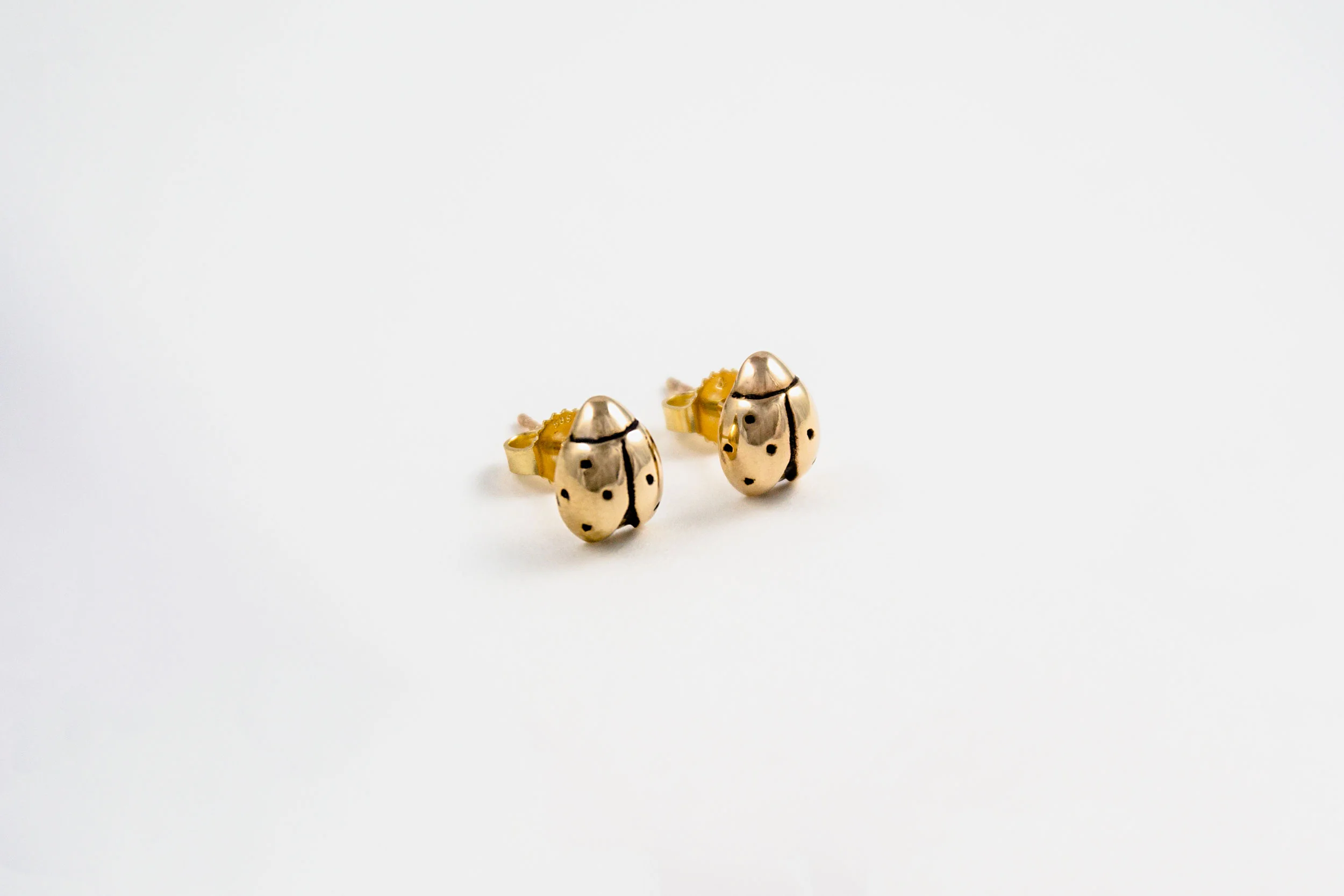 mw-ladybugEarring-gold-angle.jpg