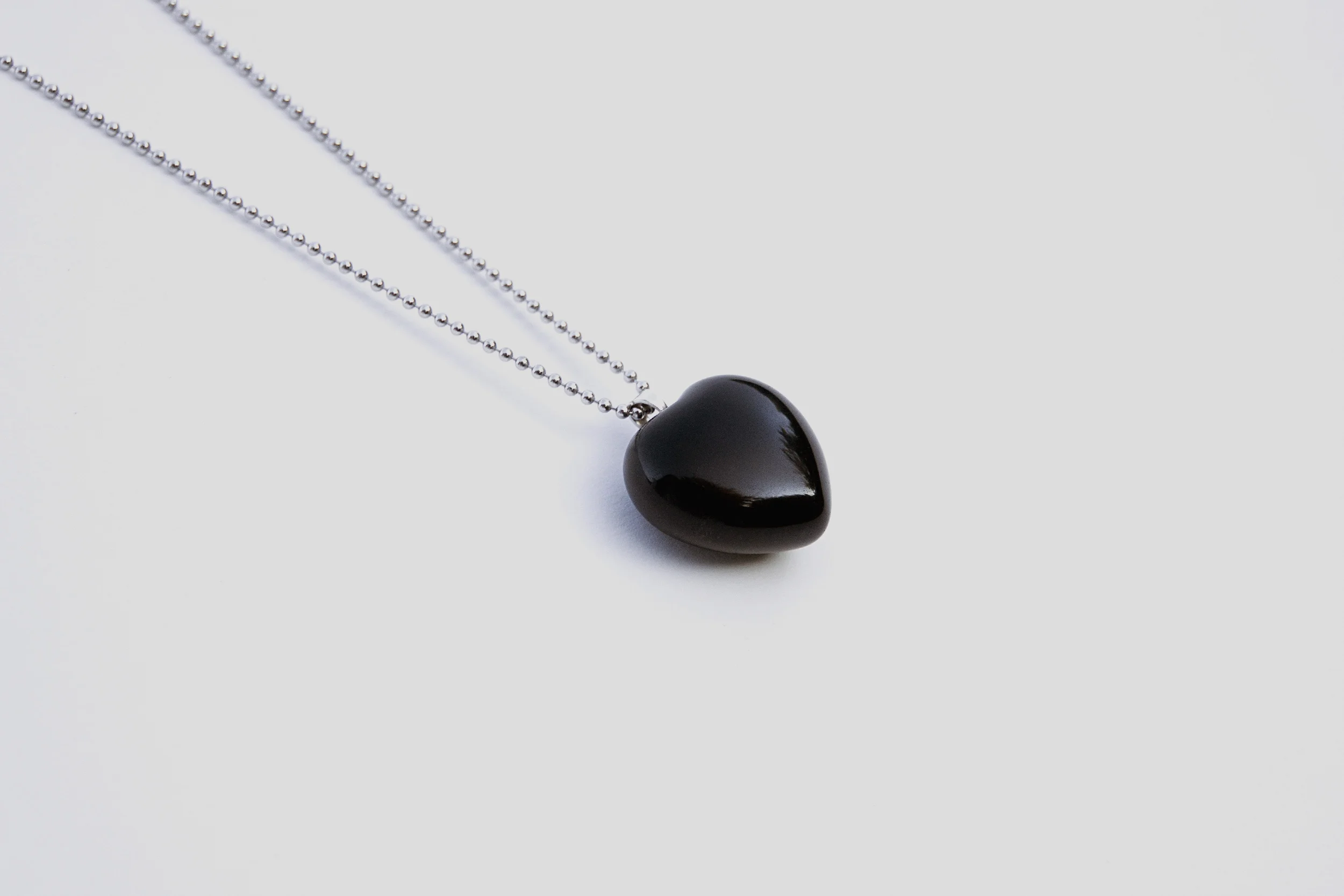 mw-puffyHeartNecklace-black-angle-1.jpg