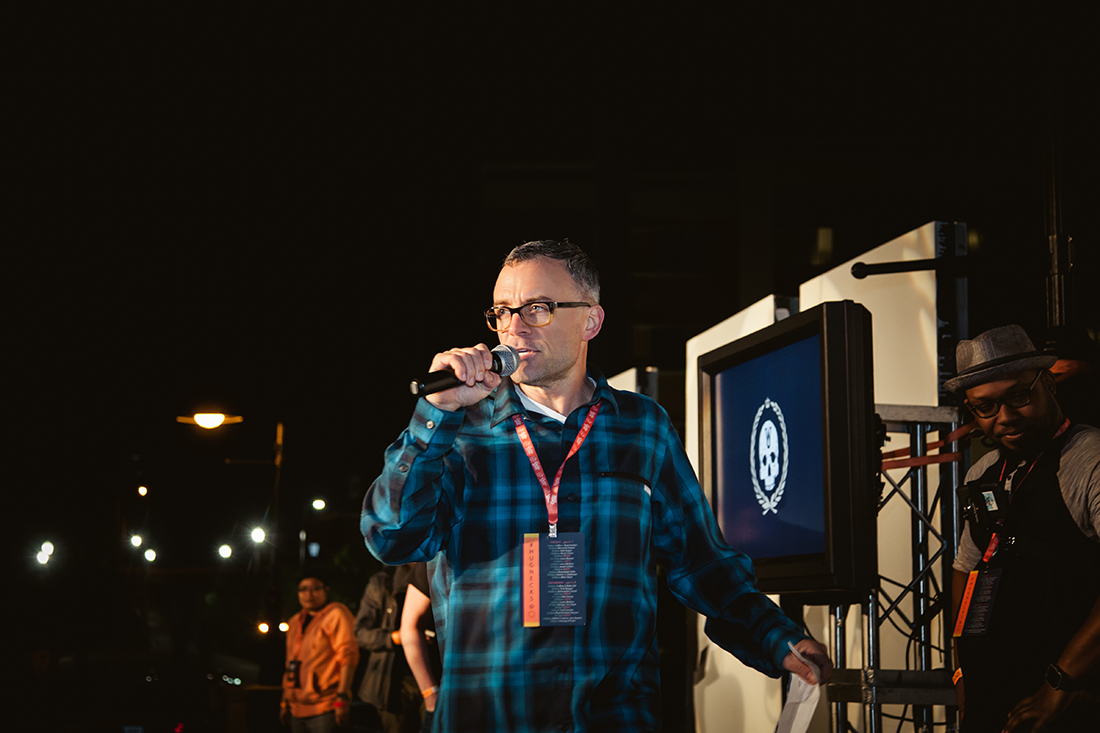 Emcee me, Dylan Menges, pretending that my leg isn't bleeding.