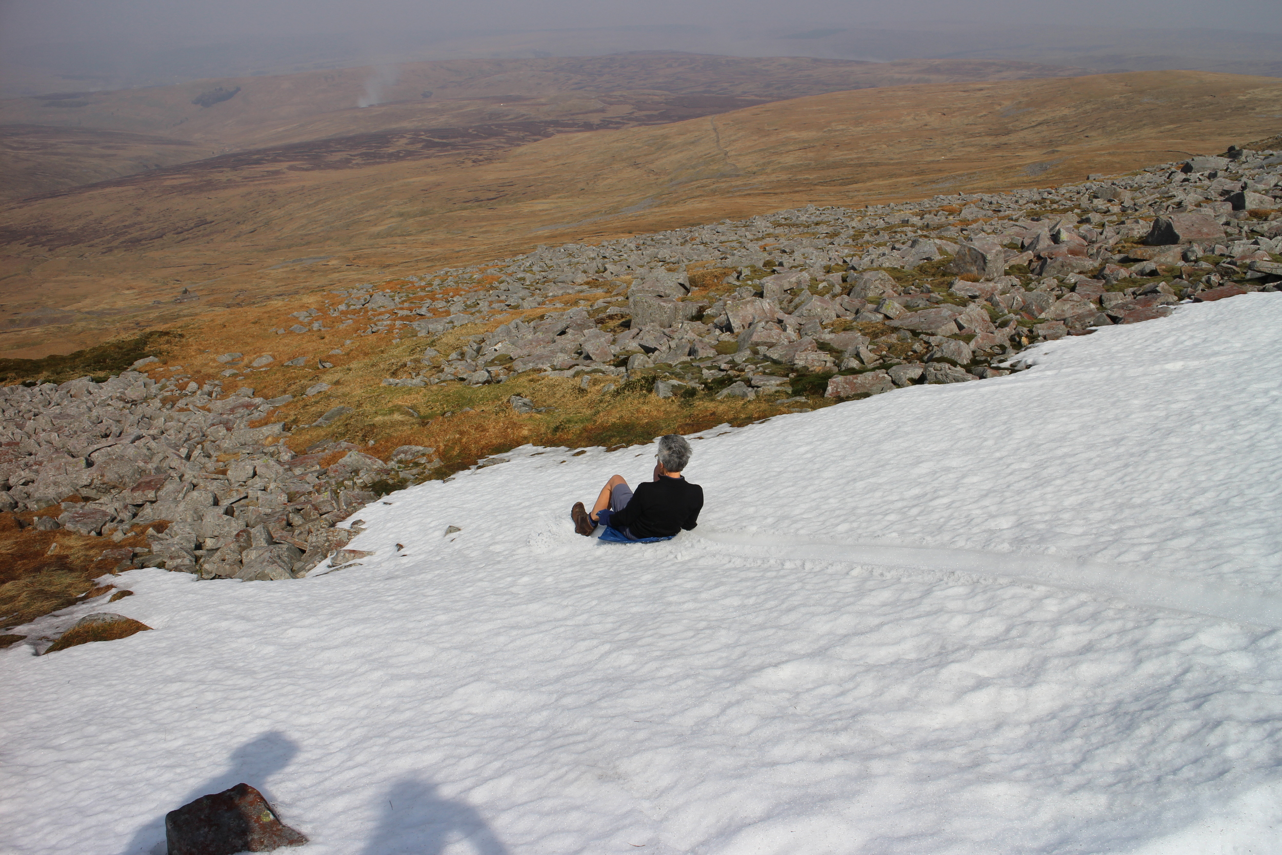  Sue sledding down from Cross Fell 