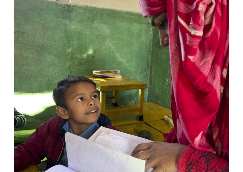 Little boy looking at teacher EF.jpg