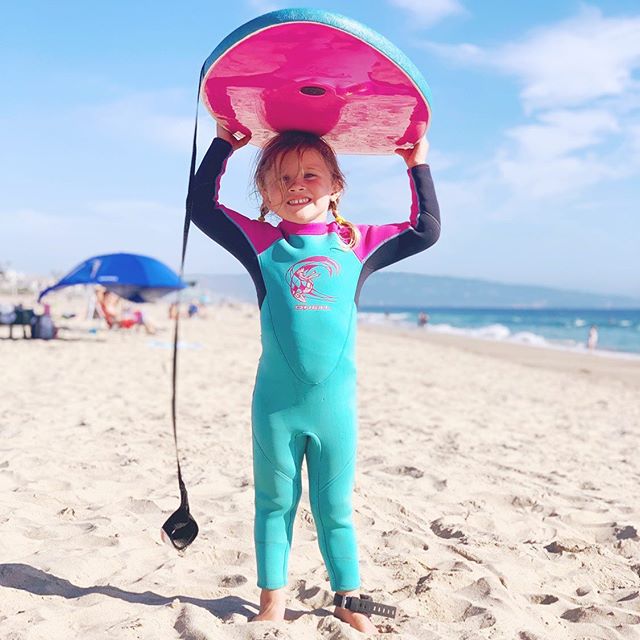 Look at this kid? We got her a mini &ldquo;surfboard&rdquo; Monday and she&rsquo;s been so excited to get to try it. It&rsquo;s really a boogie board, but she keeps asking if she can surf next to us now.
.
.
She&rsquo;s so proud!! Last night the tide