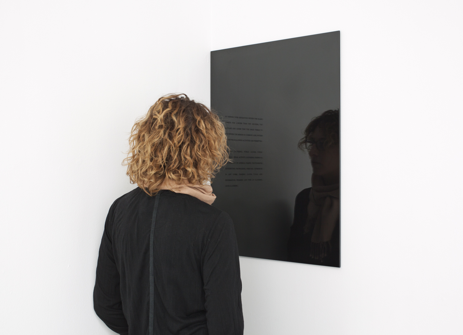  Carey Young,&nbsp;2010, Obsidian Contract, &nbsp;vinyl text and black mirror. First exhibited at Paula Cooper Gallery, New York 