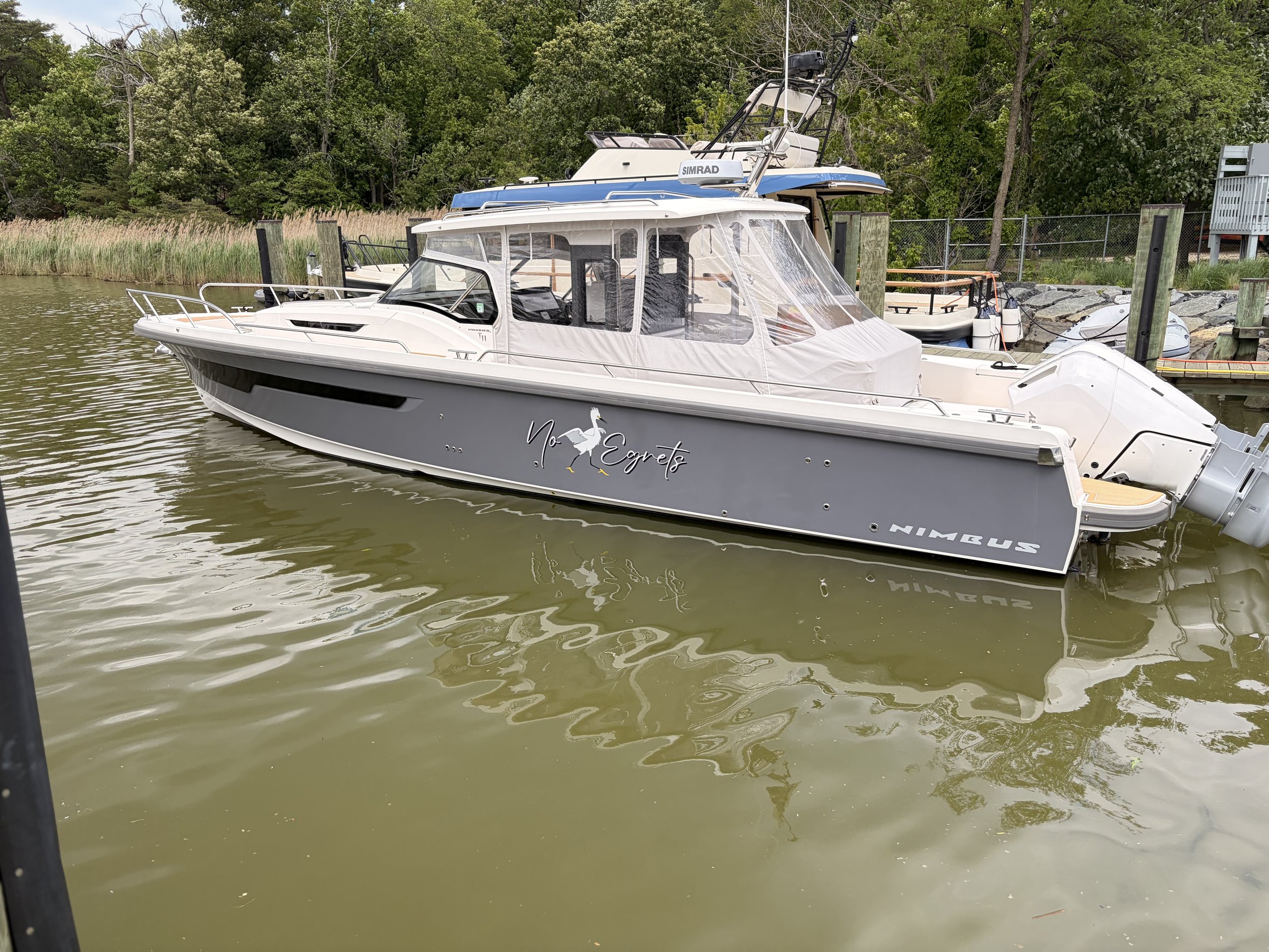 Gray vinyl hull wrap with vinyl name graphics and Nimbus logos