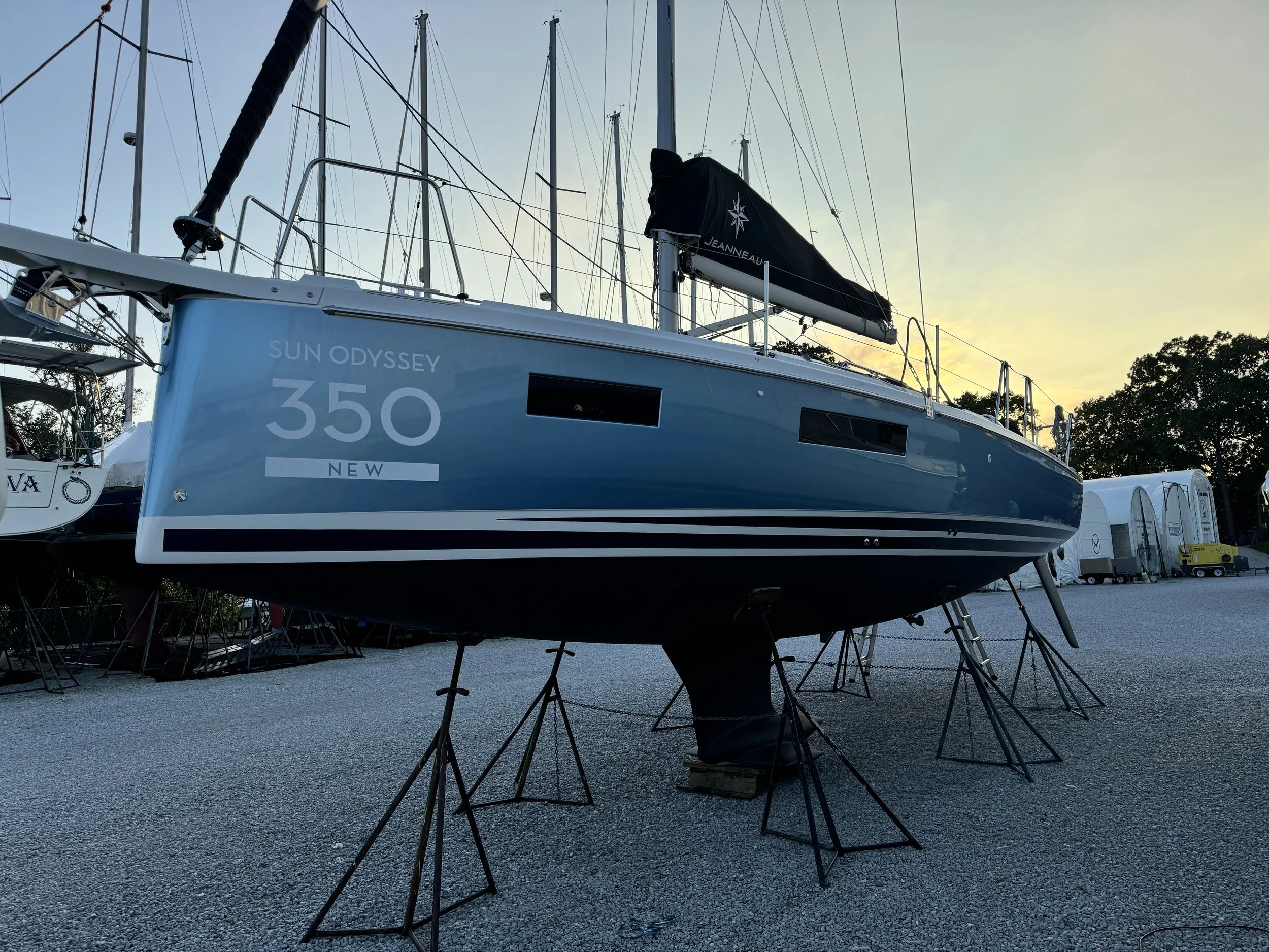 Light blue metallic vinyl hull wrap with custom dark blue vinyl boot striping