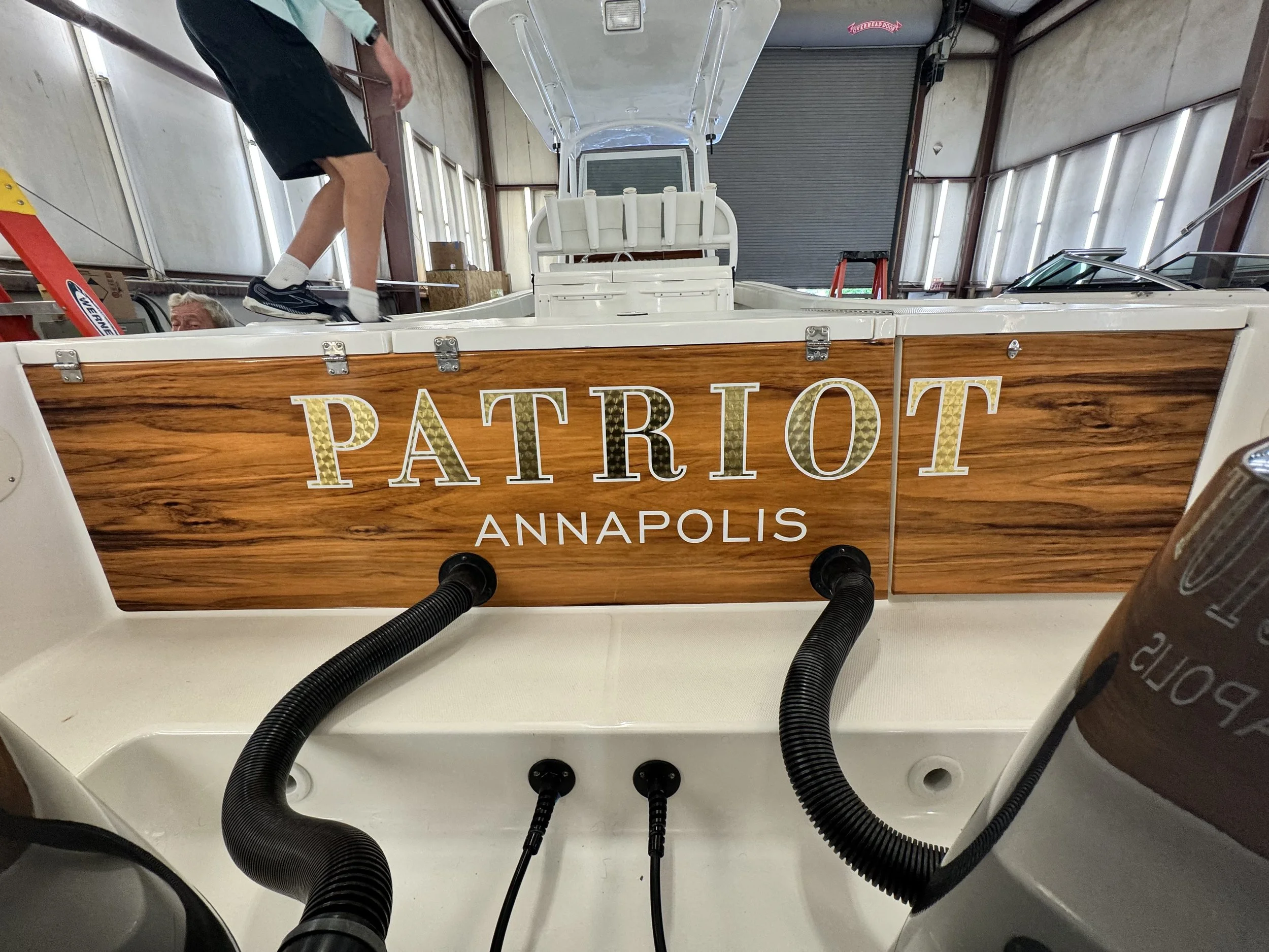 Faux wood transom wrap with 22k engine turn gold leaf name graphics
