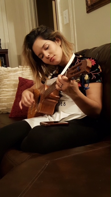 Playing the cuatro ( Venezuelan traditional instrument)