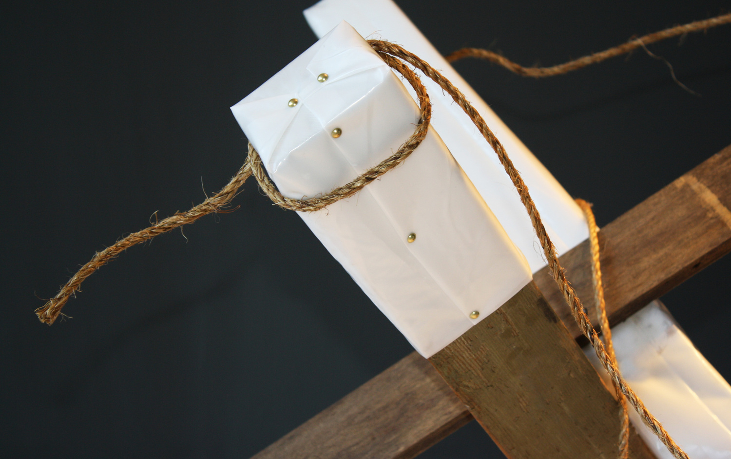 BARRICADE SCULPTURE DETAIL - visqueen, rope, wood, gold tacks