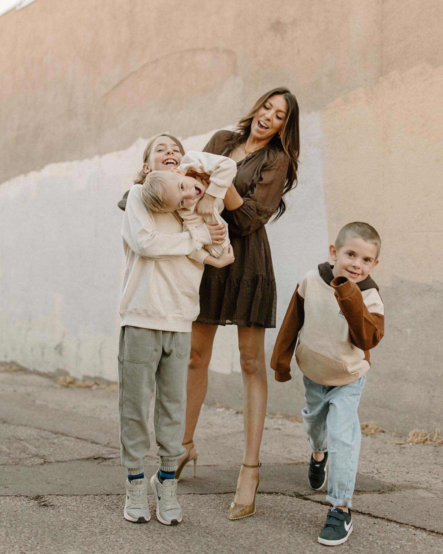 I was so excited to take photos of this gorgeous mama + her handsome boys in Colorado! I was down there for appointments and it lined up perfectly! We grabbed some photos in the alley of where she works and the color palette of this wall matched perf