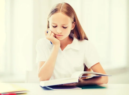 education and school concept - little student girl studying at school.jpg