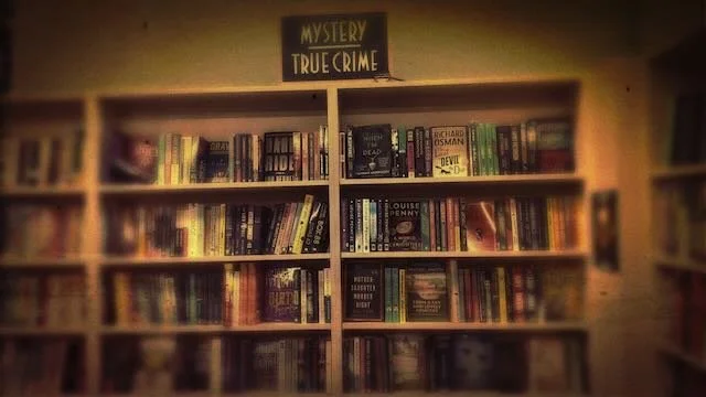 Mystery bookshelf in Knoxville, TN, bookshop, copyright 2023 Joseph D’Agnese