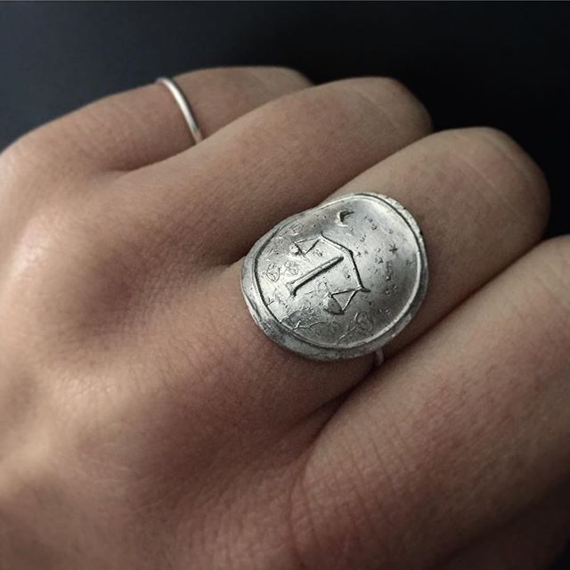 Really excited about this new collection I'm working on - hand carved and cast silver signet rings, this first one the Libra scales, with a tiny crescent moon and libra constellation in the sky, and roses around the ground, a symbolic flower for Libra. More to come with the other signs and their own unique flora. #metalsmith #lucksmithmetals #handmadejewelry #handcraftedjewelry #etsy #etsyjewelry #differencemakesus #zodiac #constellation #libra #silversmith #silverring #signetring