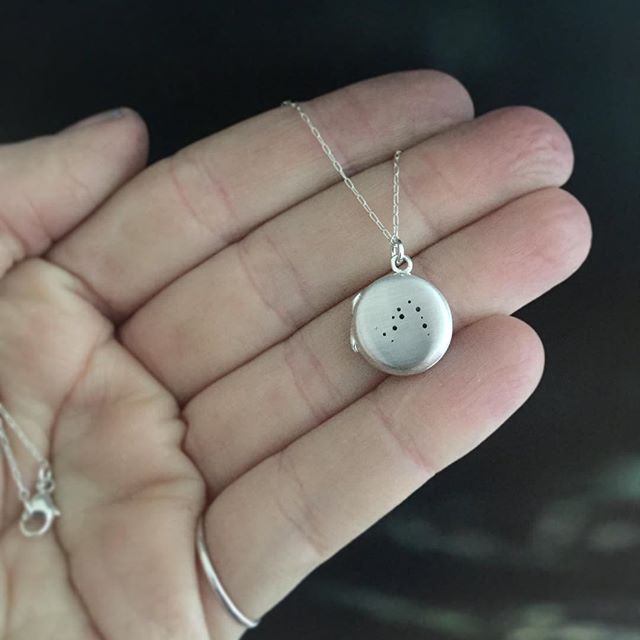 I can always tell which zodiac month it is by the locket orders - lots of Aquarius right now, and it's one of my favorites to create because it has so many stars in the constellation π this dainty sterling silver locket opens to reveal a little hand stamped date on the inside, a sweet and personal gift #metalsmith #lucksmithmetals #handmadejewelry #locket #silversmith #constellation #zodiac #aquarius #aquariusseason #etsy #differencemakesus #necklace #handcraftedjewelry
