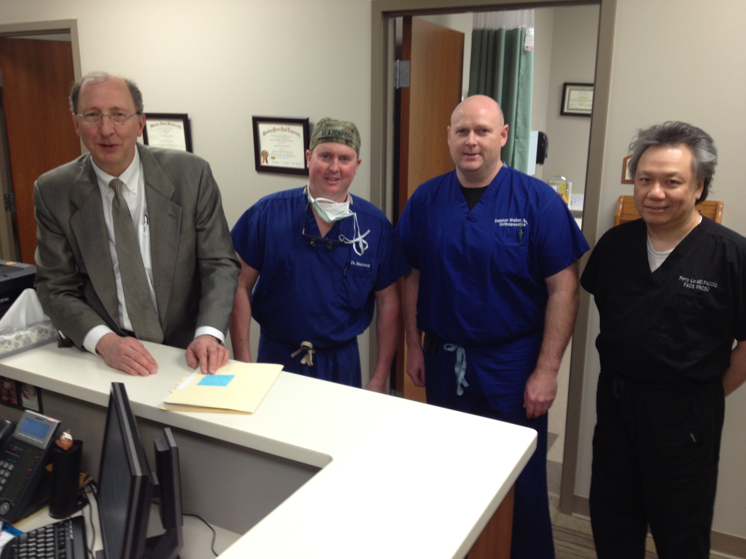 Pictured (from left): Steve Perkins, South Central Kansas Medical Center's CEO, stands with three of the hospital's physicians: Dr. Tyson Blatchford, general surgery; Dr. Damion Walker, orthopedic surgery; Dr. Perry Lin, Obstetrics & Gynecology.