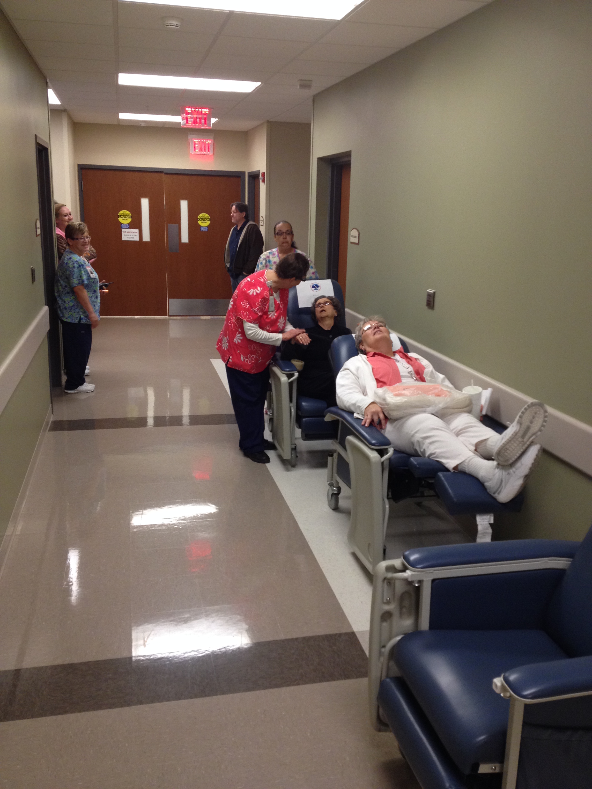 (Pictured): Susan Bartlett comforts volunteer "patient" Gloria Hull during South Central Kansas Medical Center's tornado drill.
