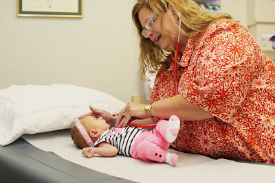 Pictured: Dr. Rhonda Green treats a young patient at South Central Kansas Clinic. The clinic is a subsidiary of the hospital and a part of SCKMC's physician recruitment strategy that could be assisted with sales tax revenue if a one-half cent increase is voted in during the November election.