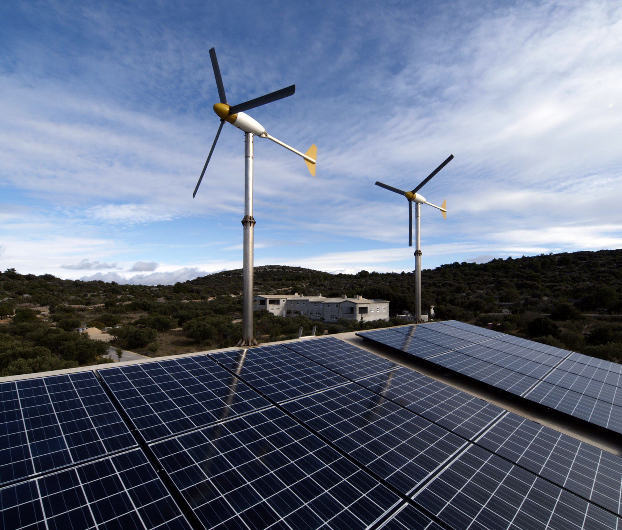 Residential wind turbines and solar panels. This rig can apparently generate 2400kWh