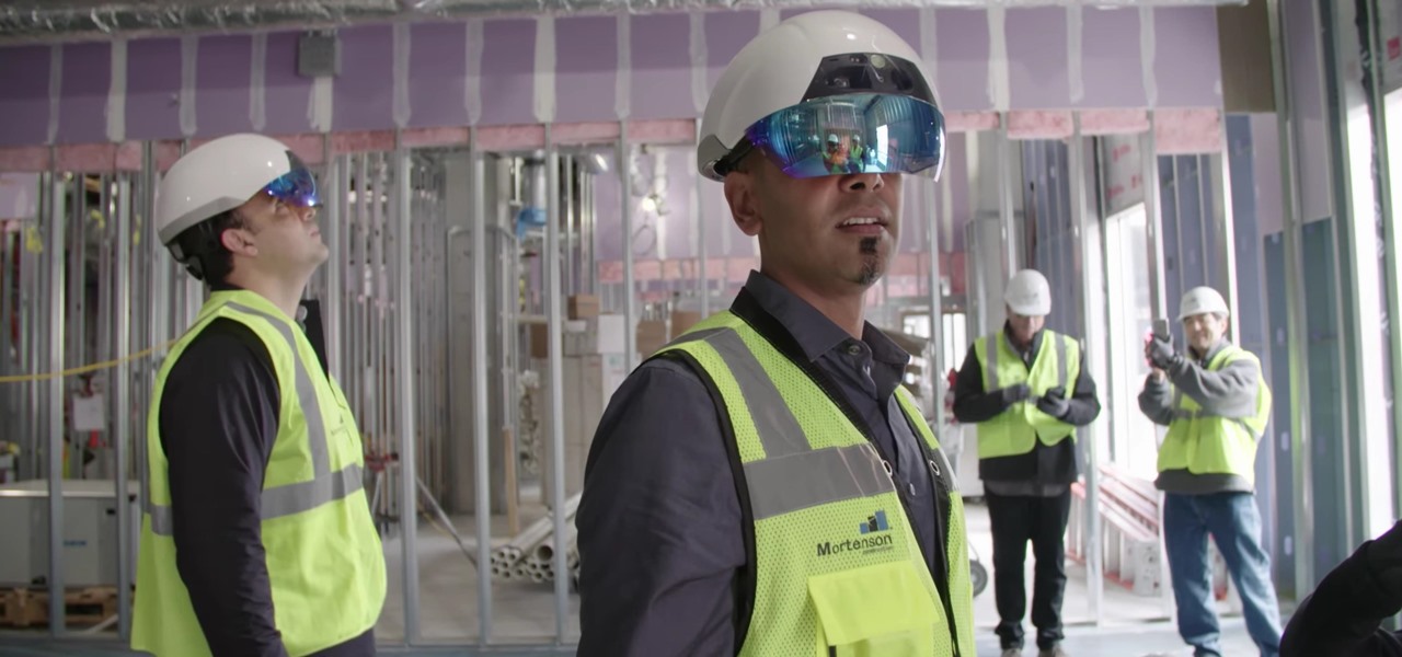 Construction workers wearing Daqri headsets so that they can "see" where ducting, electrical, plumbing, and other systems are to be located based on architectural plans.