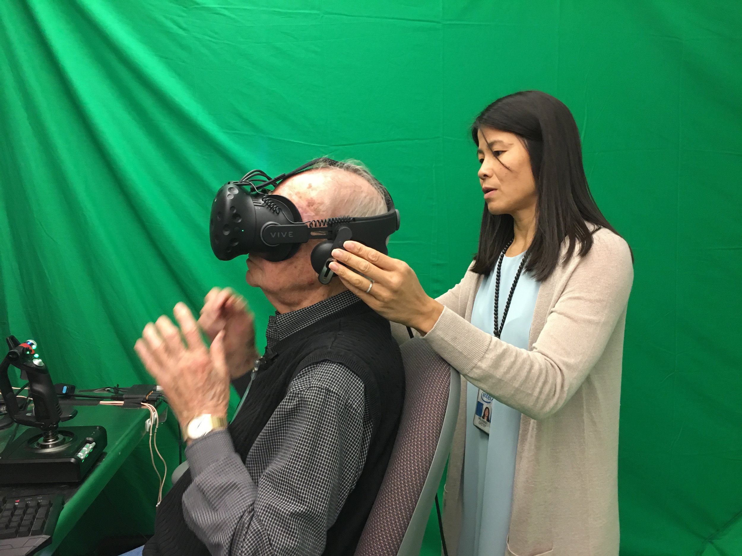 My-Hanh Eastep helps Lyle get ready for his virtual flight.