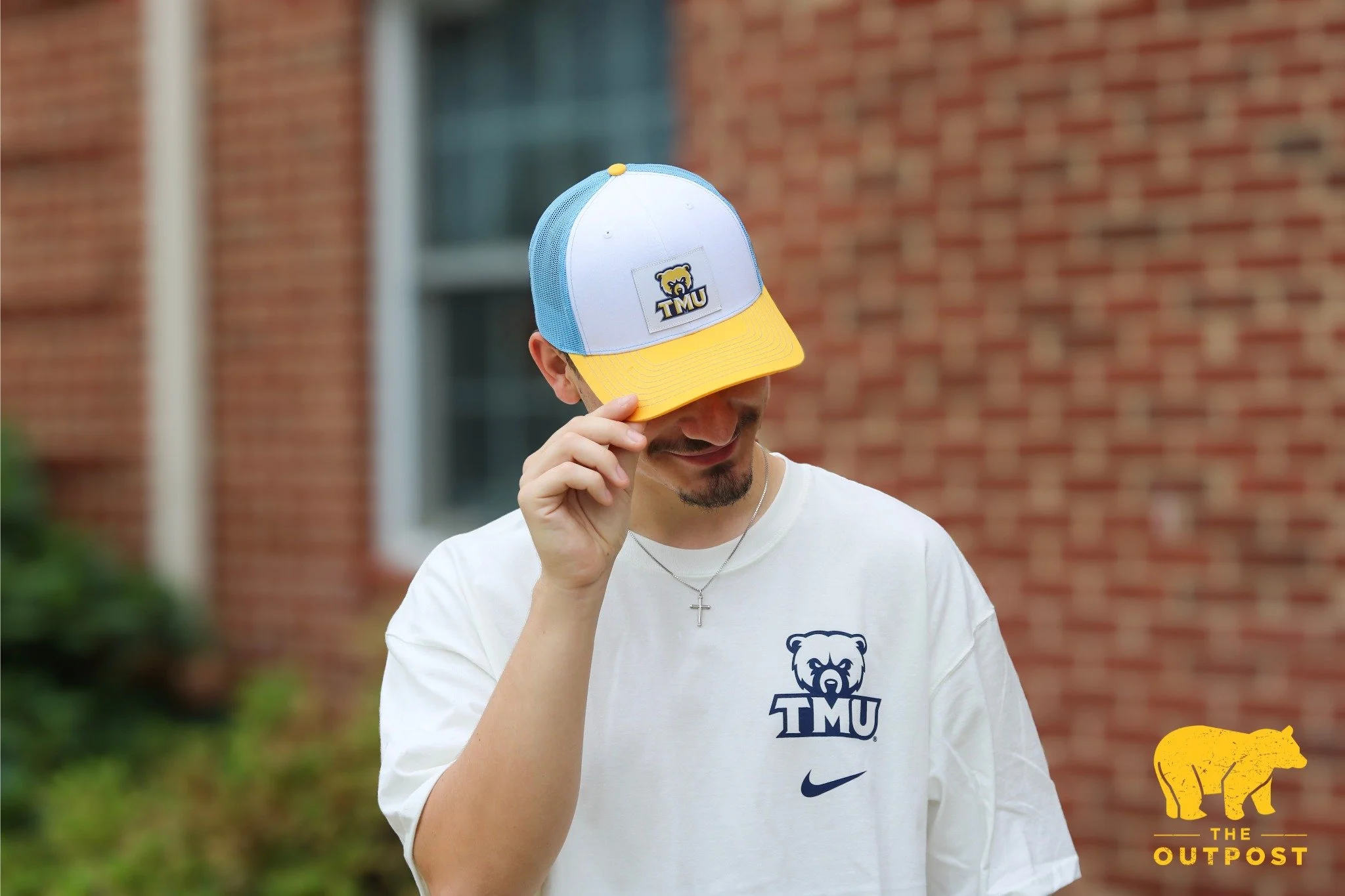 Top off your look!🧢 New tri-color hats are officially available in-store and online! #TheOutpost #TMU #GoBears