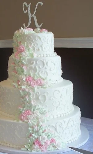 White Scrollwork with Pink Frosting Roses
