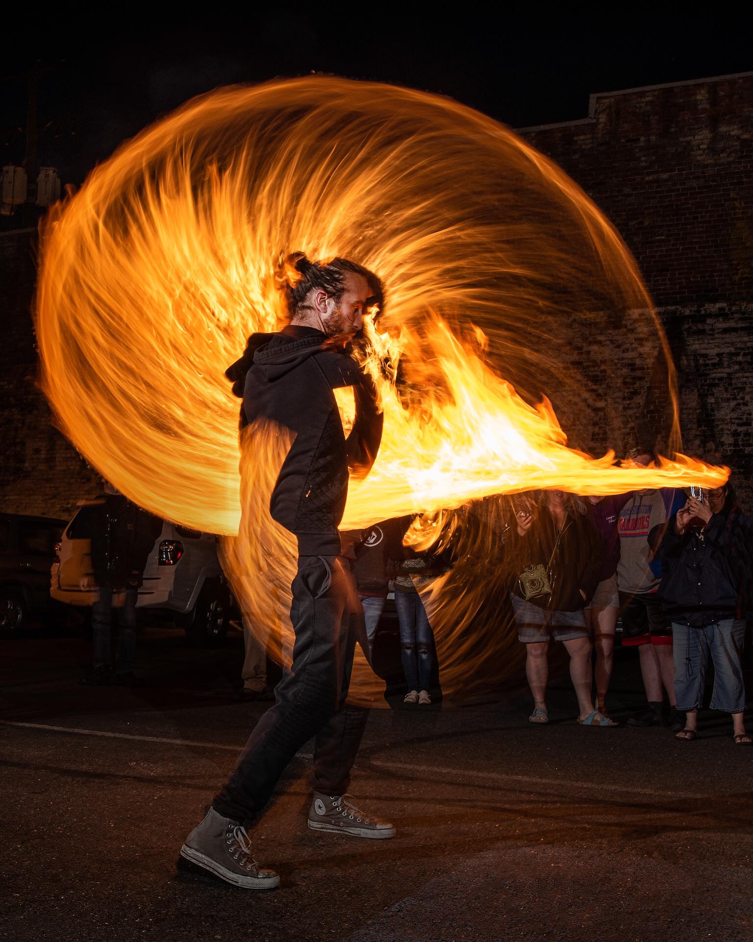 Performing with my fire sword for a growing audience.
