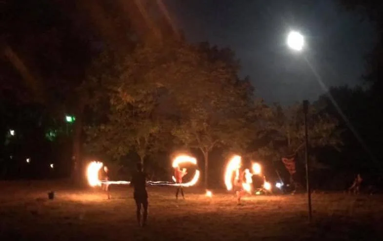 Picture of the night of our first flow fam jam, fire spinning under the full moon!