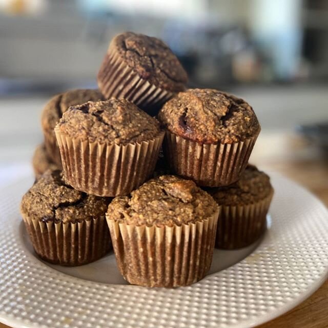 Tower of banana almond oat muffins clear in foreground. Tower of dishes obscured in background. Thank you iPhone portrait mode! 
RECIPE
Preheat oven to 350f and line 12 muffin tins with muffin cups.
In a food processor, pur&eacute;e 3 very ripe, larg