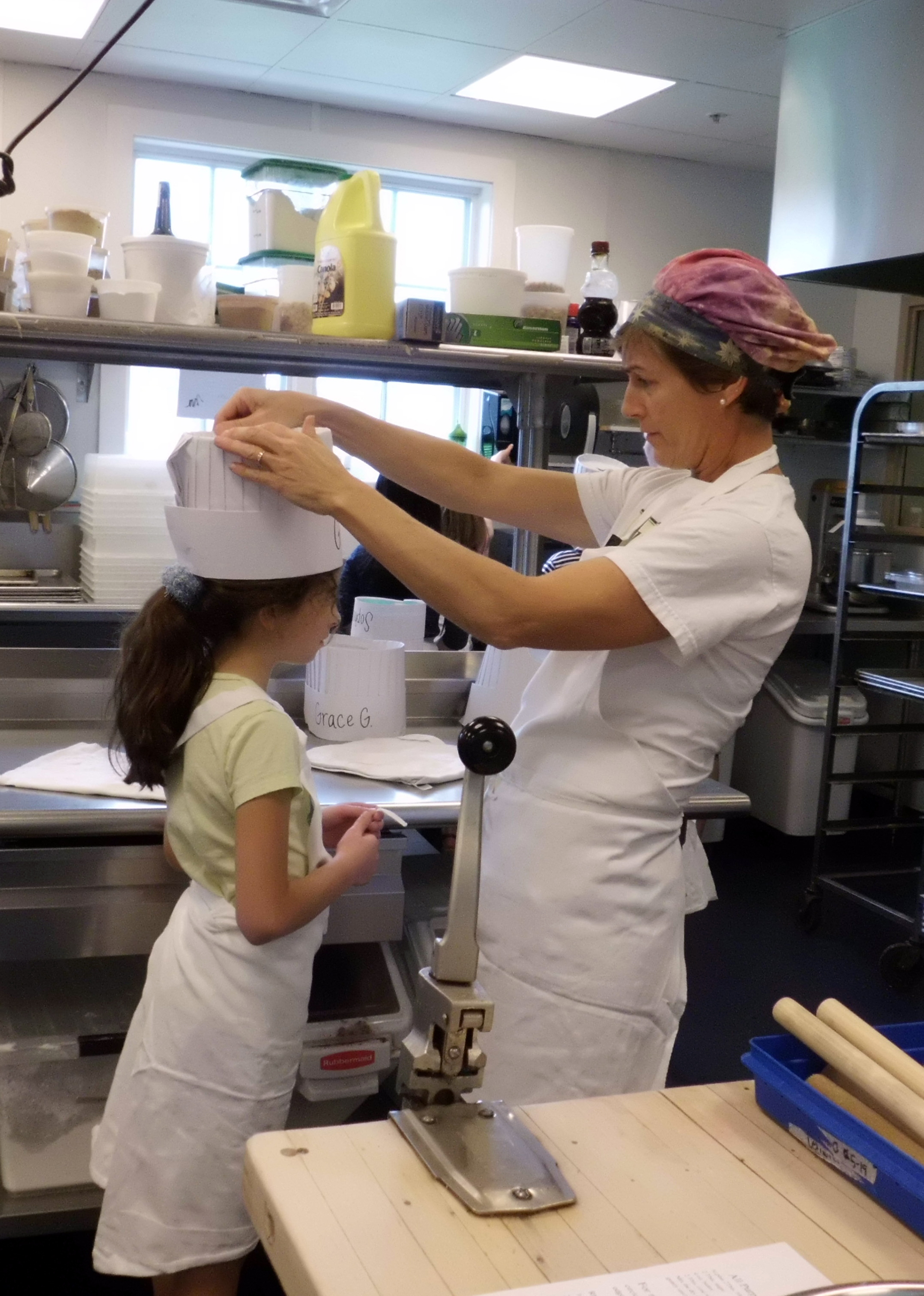 Jennifer Verrill Faddoul prepared a student for the cooking class. Photo by Anne Cushman.