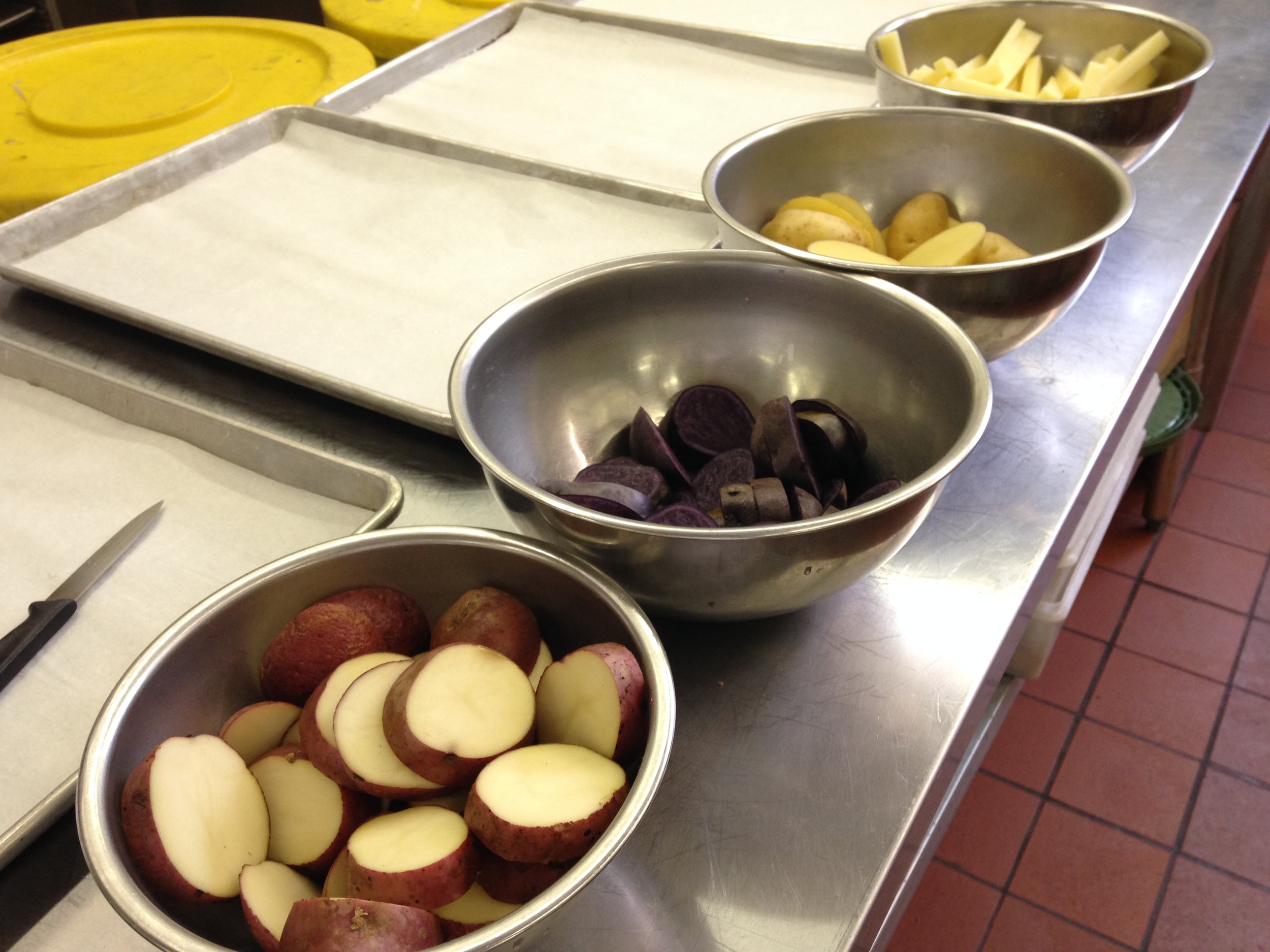 The lineup of tubers, ready to take their turn in the hot oil.