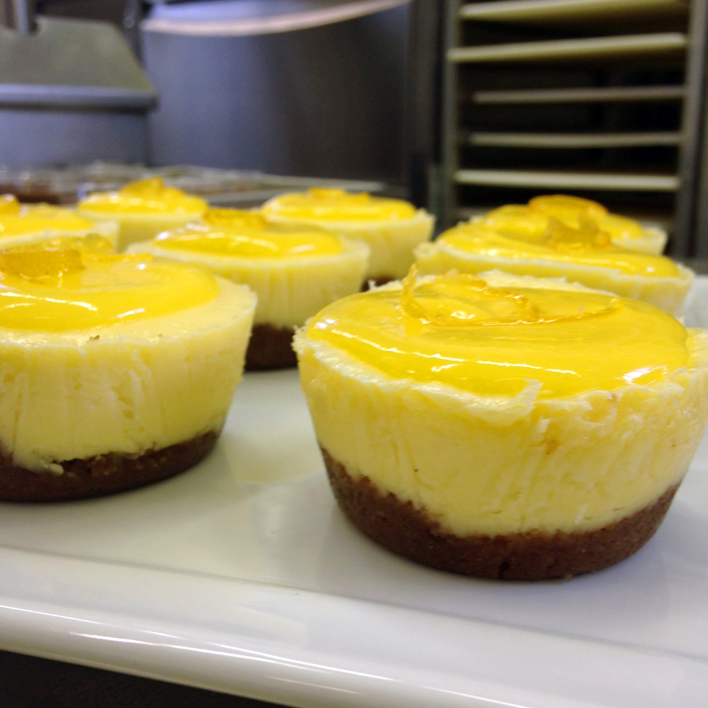 Individual cheesecakes with lemon curd and homemade graham cracker crust