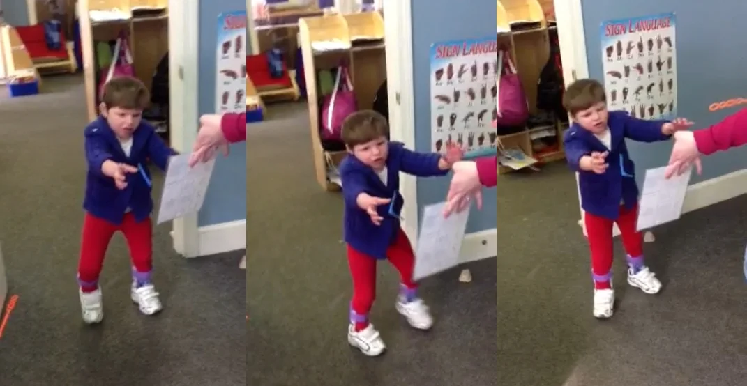 T walking at school the other day, recorded by her teacher. She might as well be giving the finger to the camera, as if to say, "Don't get your hopes up, Dad--I won't be doing this at home." 