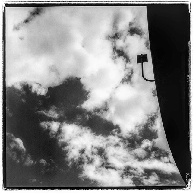 LIFE SQUARED - &ldquo;cloudy direction&rdquo; &copy; 2018 Peter DaSilva. #freeway #signpole #overhead #roadway #120 #ilford #SFX #bw #film #fullframe #rolleiflex #f4tele #filmisnotdead #ilfordphoto #filmlover #6x6 #analog #nophotoshop #filmphotograph