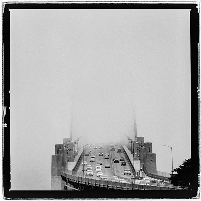 LIFE SQUARED - &ldquo;dimensional gateway&rdquo; &copy; 2018 Peter DaSilva. #dimensional #gateway  #crossing #fromheretothere #goldengatebridge #fogshrouded #120 #ilford #delta400pro #bw #film #fullframe 
#hasselblad #500f8 #filmisnotdead #filmlover 