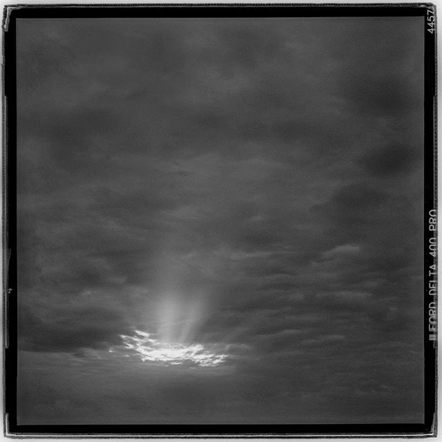 LIFE SQUARED - &ldquo;GODS light&rdquo; &copy; 2018 Peter DaSilva. #morninglight #clouds #overhead #breakinthesky #godslight #120 #ilford #delta400pro #bw #film #fullframe #rolleiflex #f4tele #filmisnotdead #ilfordphoto #filmlover #6x6 #analog #nopho