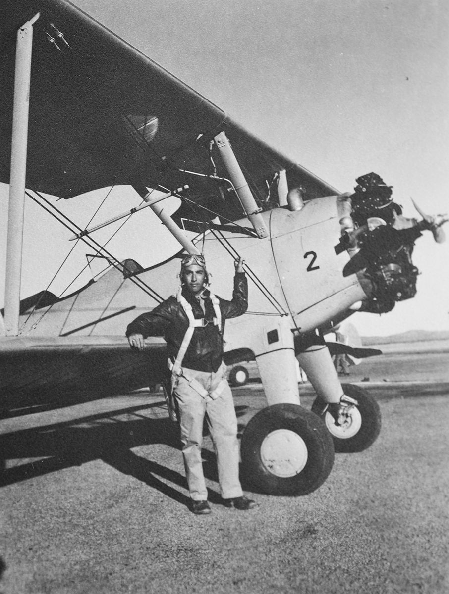 Herb during training standing next to the Stearman PT-17