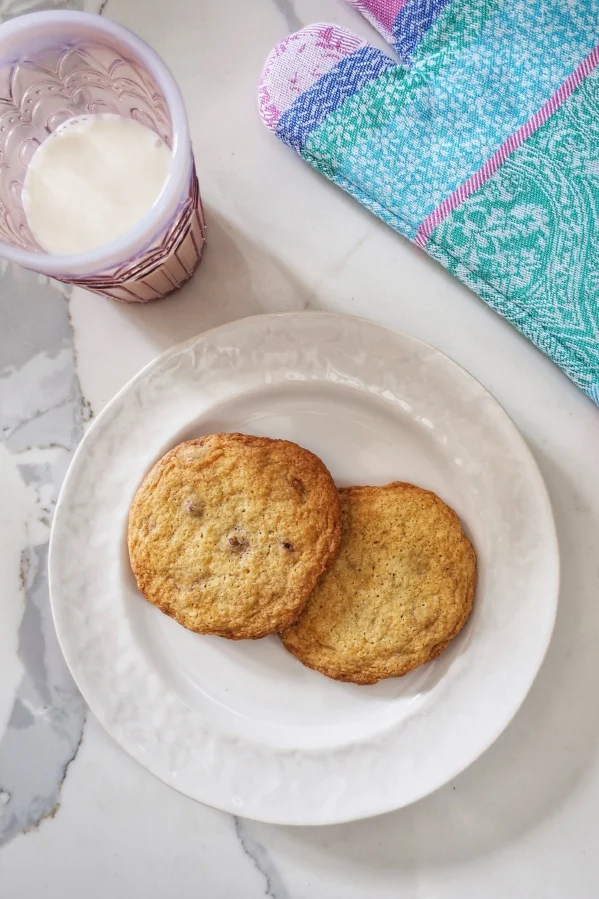 plate of gluten free chocolate chip cookies with a glass of milk