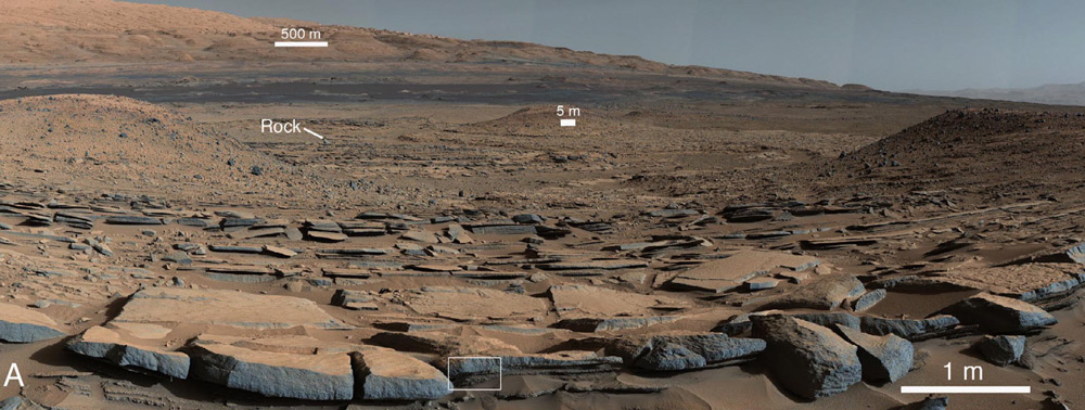 A view from the Kimberley formation looking south. The strata in the foreground dip towards the base of Mount Sharp, indicating the ancient depression that existed before the larger bulk of the mountain formed. - Credit: NASA/JPL-Caltech.
