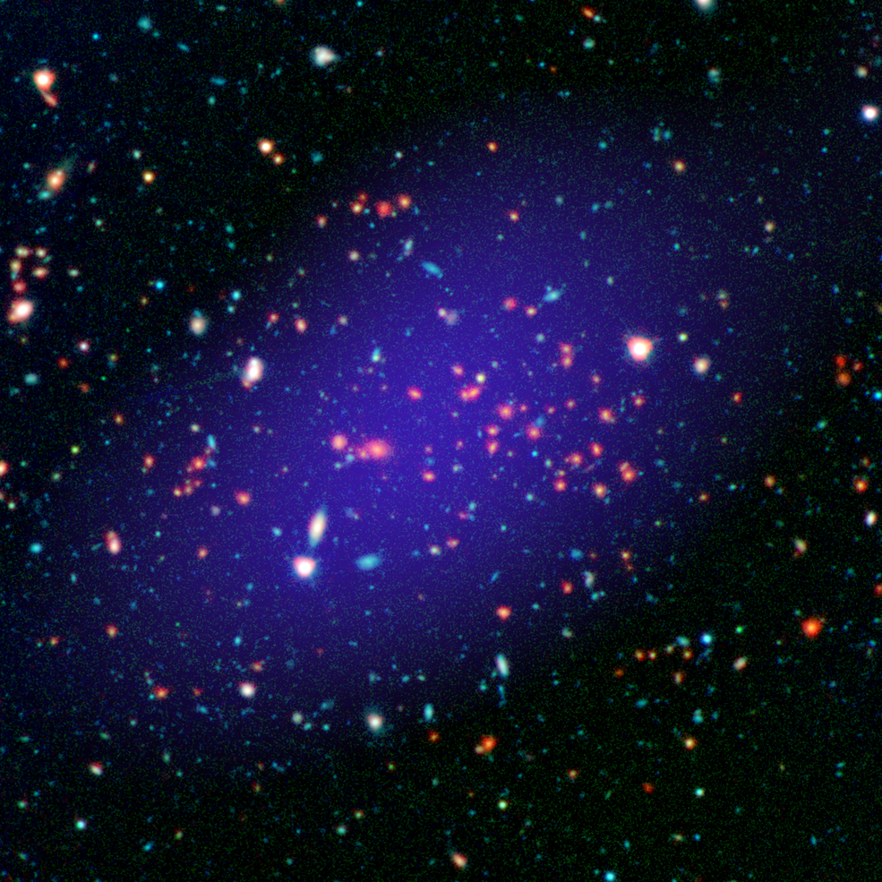 The galaxy cluster called MOO J1142+1527 can be seen here as it existed when light left it 8.5 billion years ago. The red galaxies at the center of the image make up the heart of the galaxy cluster. - Image credit: NASA/JPL-Calltech/Gemini/CARMA