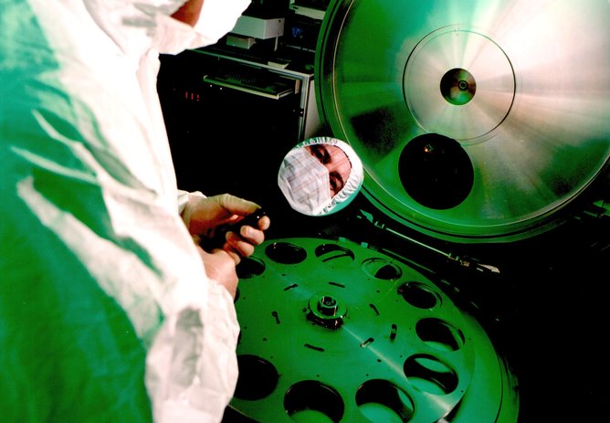 Adrian Cansell loading a 100mm silicon wafer into a 200 kV ion implanter. – Image Credit: University of Surrey Ion Beam Centre , Author provided