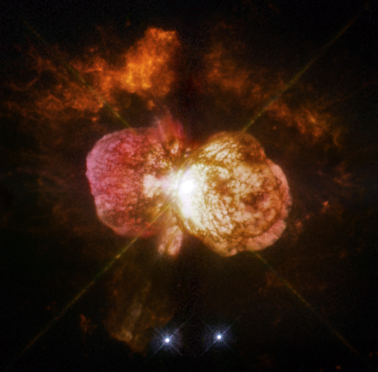 Eta Carinae's great eruption in the 1840s created the billowing Homunculus Nebula, imaged here by Hubble, and transformed the binary into a unique object in our galaxy. Astronomers cannot yet explain what caused this eruption. The discovery of likely Eta Carinae twins in other galaxies will help scientists better understand this brief phase in the life of a massive star. - Image Credits: NASA, ESA, and the Hubble SM4 ERO Team