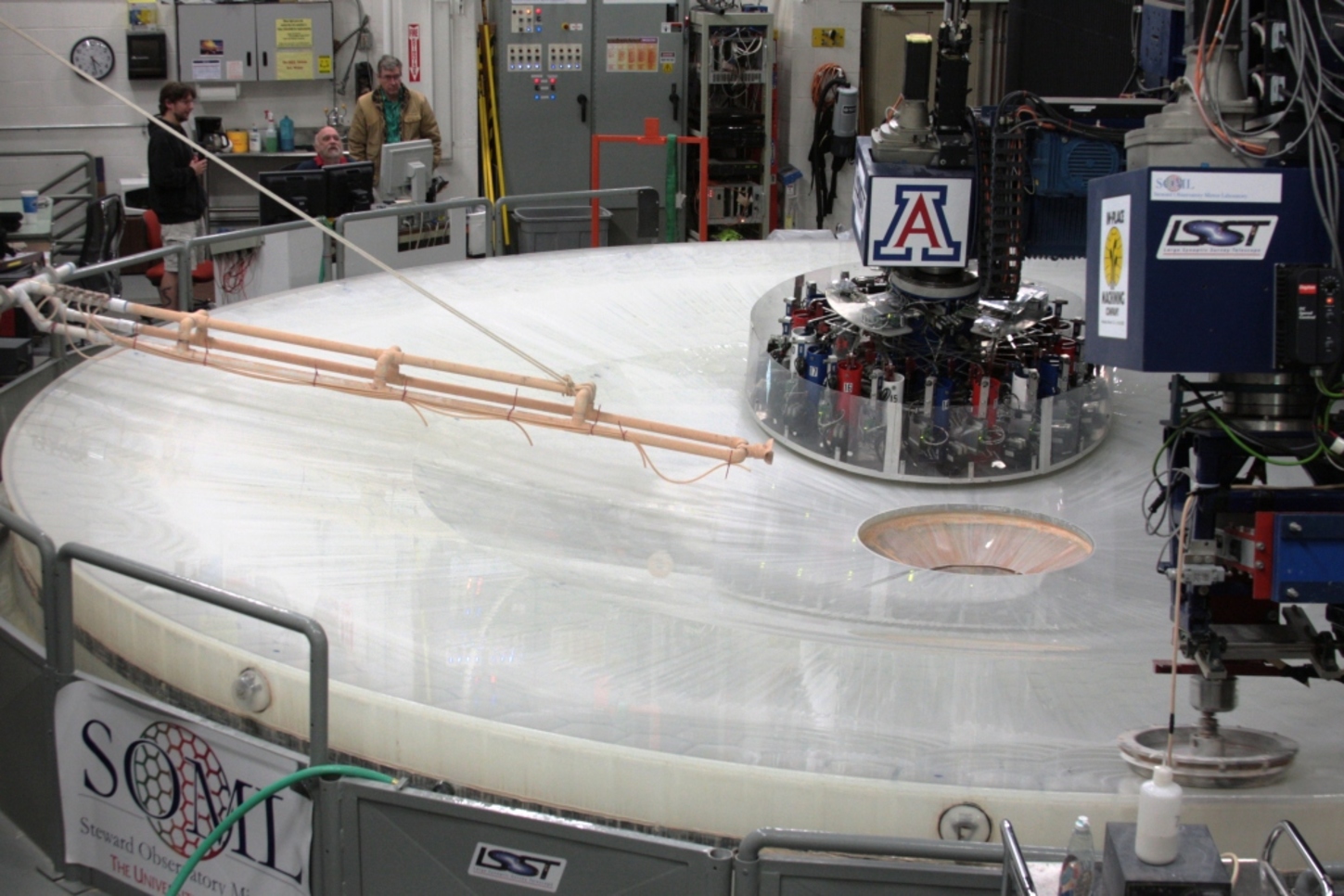 An 8.4-meter mirror for the Large Synoptic Survey Telescope being polished at the Richard F. Caris Mirror Lab. – Image Credit: Steward Observatory