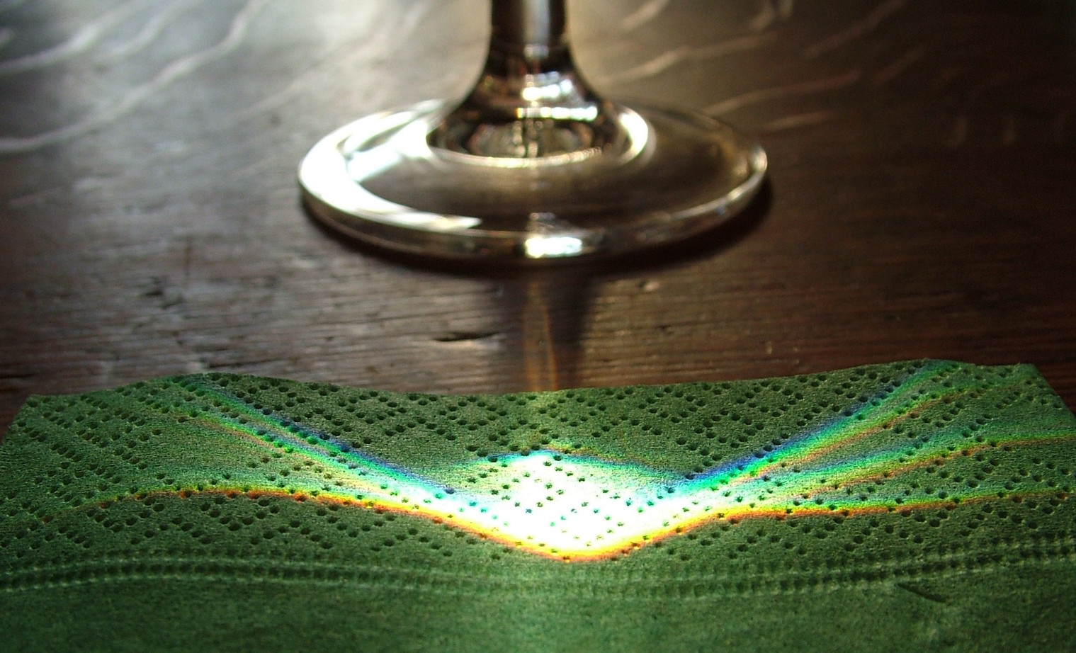 Note the differing colours from the light through the wineglass - Image Credit: anataman/flickr