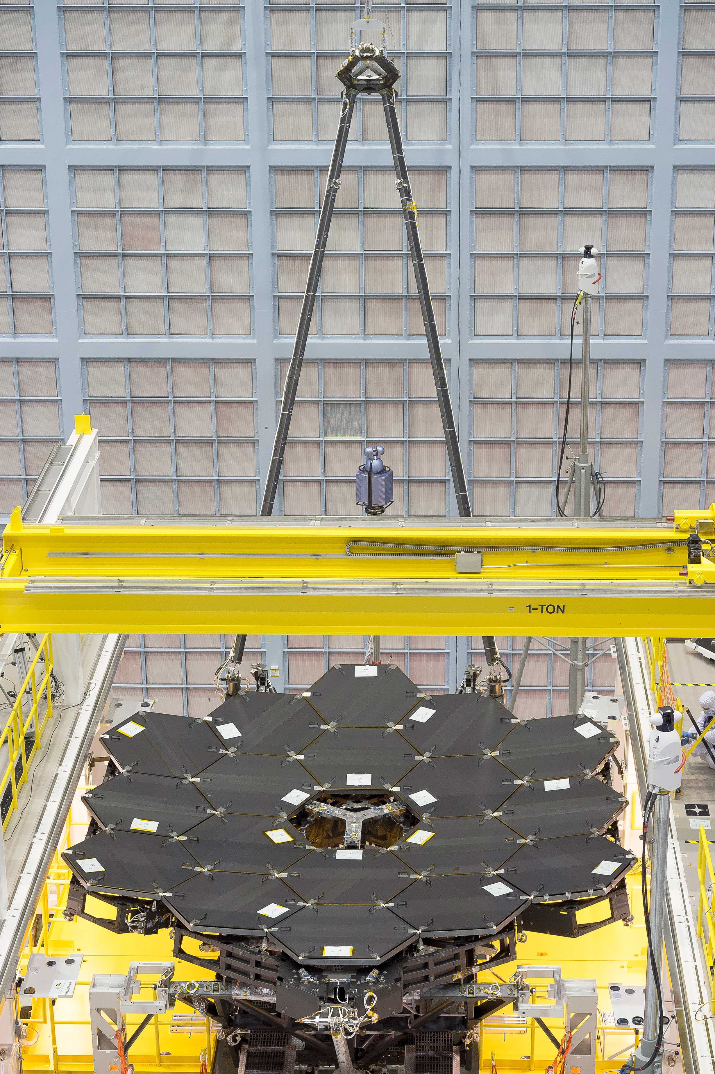 In this rare view, the James Webb Space Telescope's 18 mirrors are seen fully installed on the James Webb Space Telescope structure at NASA's Goddard Space Flight Center in Greenbelt, Maryland. - Image Credits: NASA/Chris Gunn
