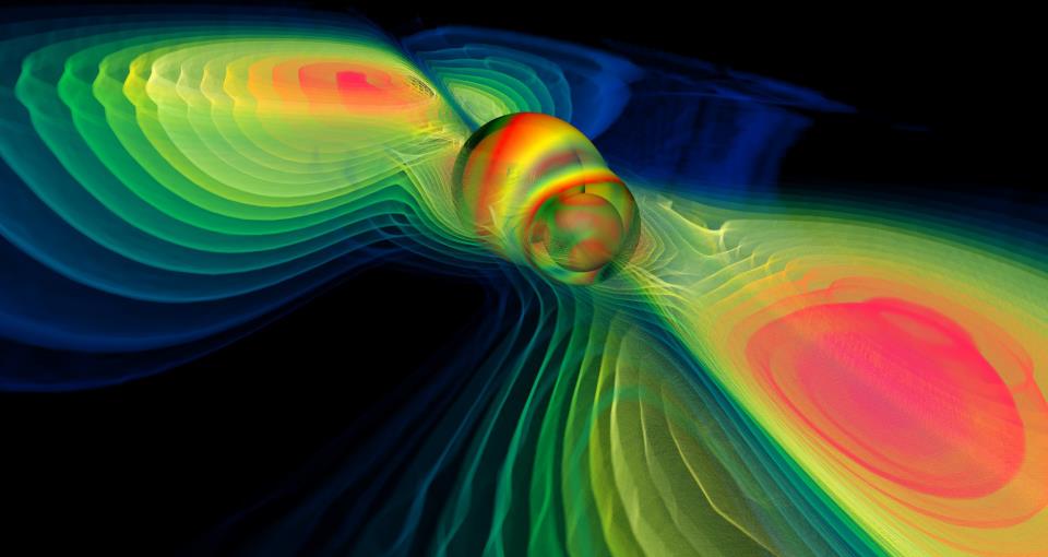 Computer simulation of two merging black holes producing gravitational waves. – Image Credit: NASA Blueshift/WikimediaCommons