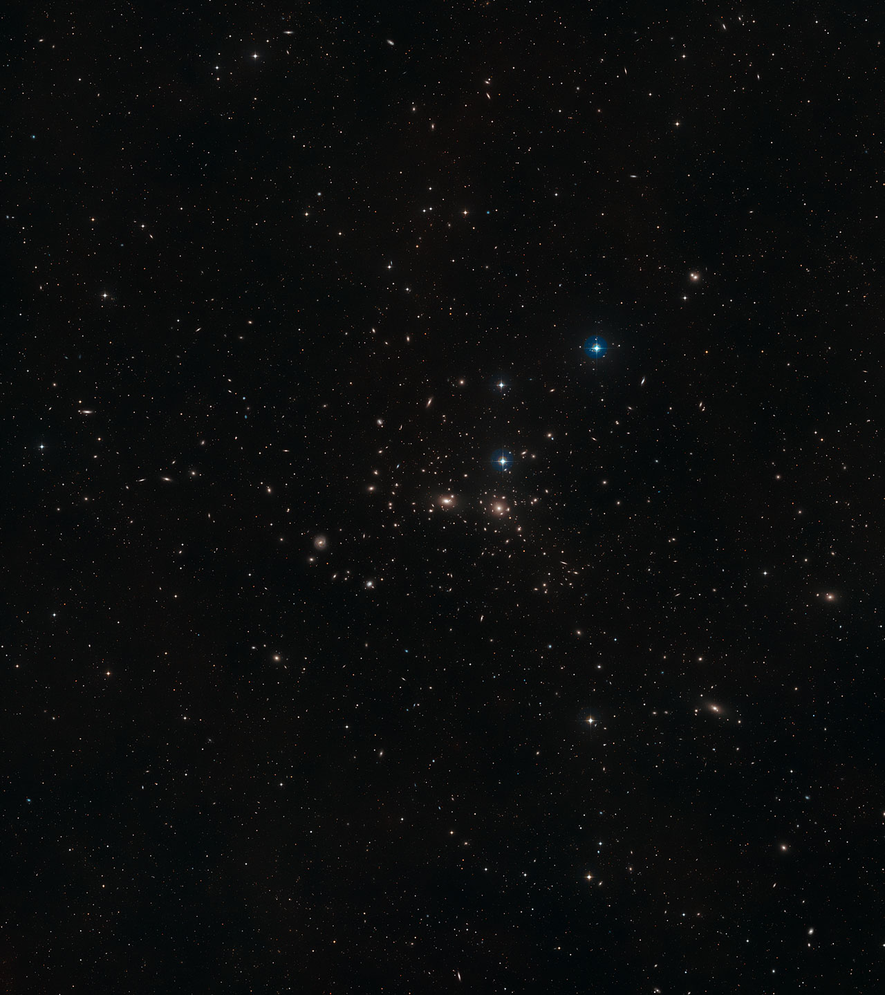 This image shows a ground-based wide-field view of the region around NGC 4889 from the Digitized Sky Survey 2 - Image Credit: NASA, ESA, Digitized Sky Survey 2 – Acknowledgement: David De Martin